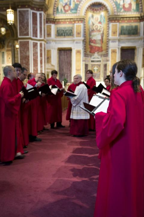 Members of the Schola Cantorum sing Gregorian chant in the center aisle at the beginning of a Latin Mass Oct. 8, 2018, at the Cathedral of St. Matthew the Apostle in Washington. (CNS/Chaz Muth)