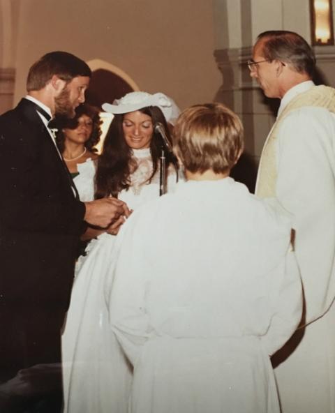 Jesiut Fr. Ray Schroth, right, presides over the nuptial mass for Loretta Tofani and John White at the Annunciation Church in Crestwood, New York, in 1983. (Courtesy of Loretta Tofani)