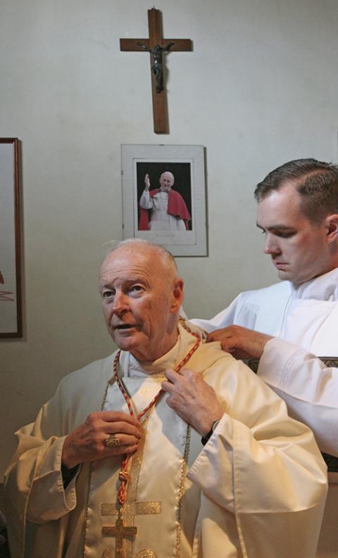 Theodore McCarrick prepares to celebrate Mass at his titular church of St. Nereus and Achilleus in Rome April 14, 2005. The then-cardinal was in Rome to participate in the conclave that elected Pope Benedict XVI. (CNS/Nancy Wiechec)