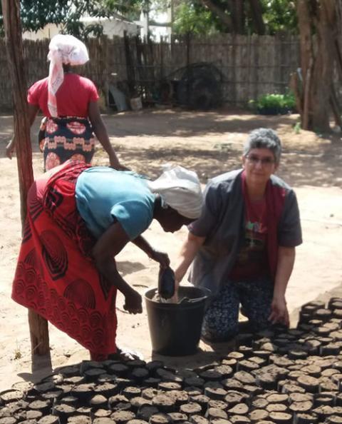 Sr. Blanca Nubia of the Carmelitas Teresas de San José works with displaced women to plant seedlings at a nursery. (Courtesy of Blanca Nubia)