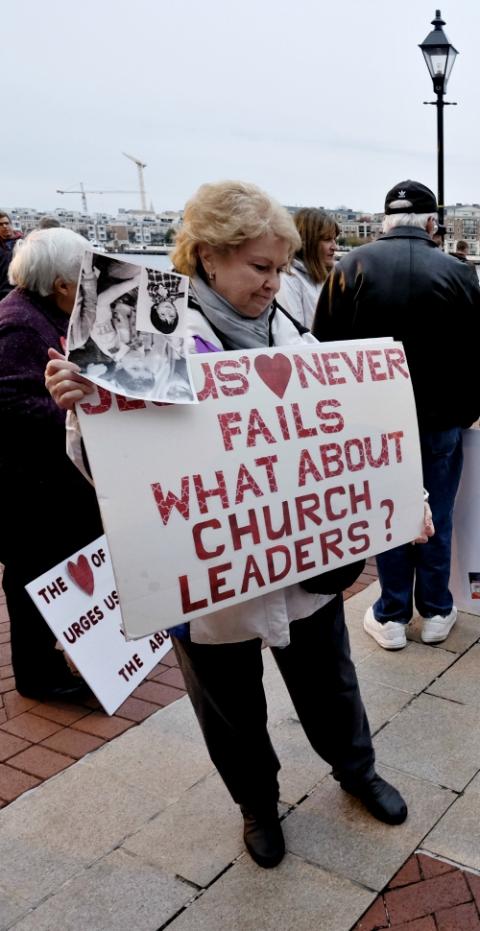 Ann Hurleypalmer joins other protesters Nov. 12 outside the hotel in Baltimore where the U.S. Conference of Catholic Bishops was meeting during its fall general assembly. (CNS/Tennessee Register/Rick Musacchio)