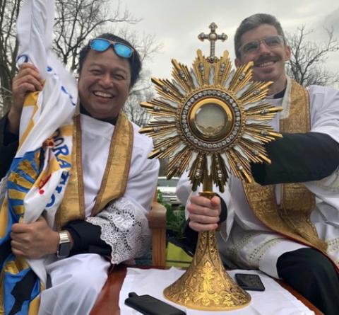 Fr. Santos "Sunny" Castillo, left, and parochial vicar Fr. John Horan of St. John Paul II Catholic Parish in Kankakee, Illinois, drive around parishioners' neighborhoods on Easter morning April 12. (Courtesy of Fr. Santos Castillo) Fr. Santos "Sunny" Castillo, left, and parochial vicar Fr. John Horan of St. John Paul II Catholic Parish in Kankakee, Illinois, drive around parishioners' neighborhoods on Easter morning April 12. (Courtesy of Fr. Santos Castillo)