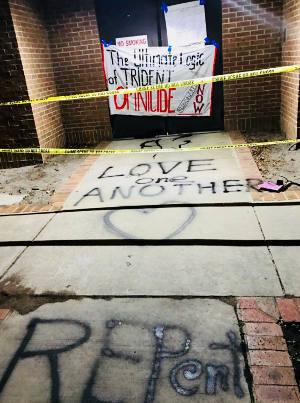 Part of the graffiti messaging left at the Kings Bay Submarine Base in April 2018. (RNS photo/Courtesy of the Kings Bay Plowshares 7)