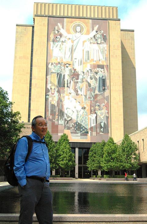 Phil Sakimoto and Word of Life mural at Notre Dame's Hesburgh Library Phil Sakimoto stands in front of the "Word of Life" mural on the Hesburgh Library at the University of Notre Dame (William E. O'Dell)