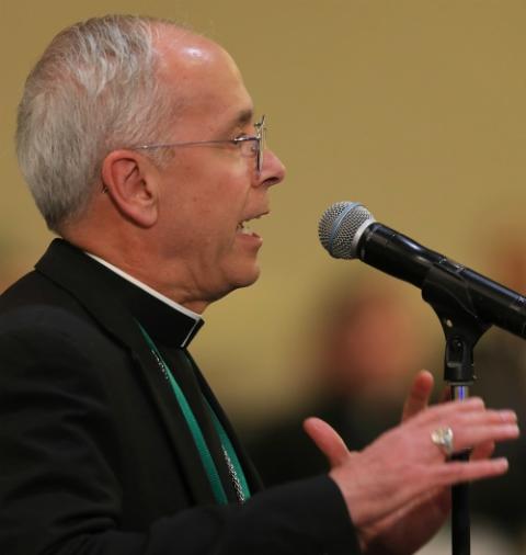 Bishop Mark Seitz of El Paso, Texas, speaks from the floor during the U.S. bishops' assembly in Baltimore Nov. 12. (CNS/Bob Roller)