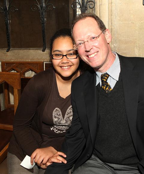 Dr. Paul Farmer with his oldest daughter, Catherine, at Christ Church, Oxford, England, during the 2011 Skoll World Forum (Flickr/Skoll Foundation)