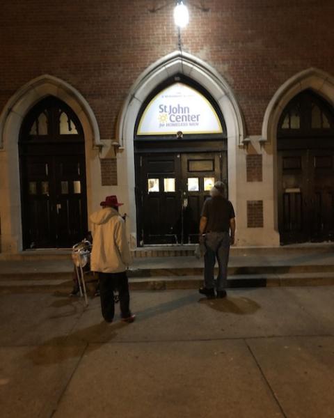 People wait in the early morning in front of St. John Center in Louisville, Kentucky. The shelter is one of three programs operated by the agency, which includes street outreach, social services program, and a supportive housing program that works with 92 People wait in the early morning in front of St. John Center in Louisville, Kentucky. The shelter is one of three programs operated by the agency, which includes street outreach, social services program, and a supportive housing program that works with 92