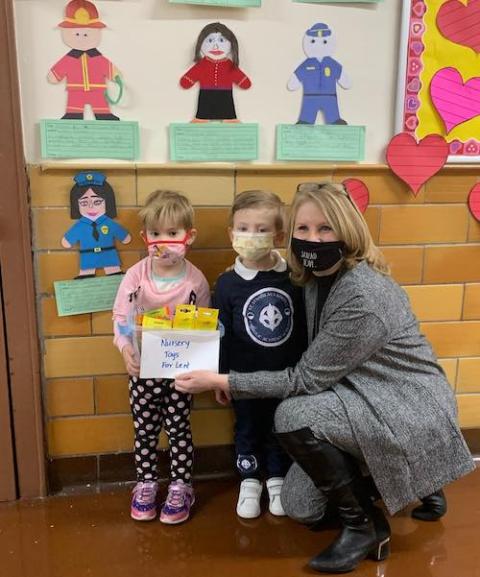 Two students stand with their teacher at St. Stanislaus Kostka Catholic Academy in Queens, New York. (Courtesy of the Brooklyn Diocese) Two students stand with their teacher at St. Stanislaus Kostka Catholic Academy in Queens, New York. (Courtesy of the Brooklyn Diocese)
