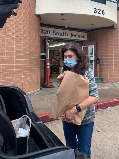 Carol Herrera prepares to load food into a car at Catholic Charity’s Guadalupe Center in East Houston. (Provided photo) Carol Herrera prepares to load food into a car at Catholic Charity’s Guadalupe Center in East Houston. (Provided photo)