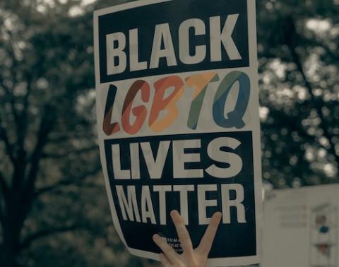 Sign reading "Black LGBTQ Lives Matter" (Unsplash/Clay Banks)