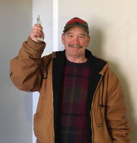 Kenny, a former resident of the St. John's Center in Louisville, Kentucky, shows the keys to his new apartment. (Maria Price) Kenny, a former resident of the St. John's Center in Louisville, Kentucky, shows the keys to his new apartment. (Maria Price)