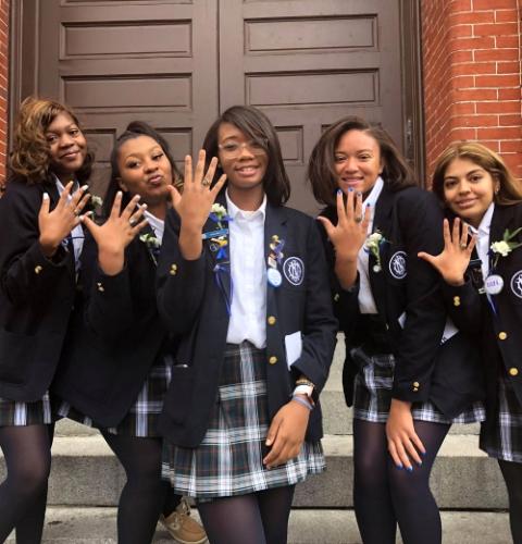 From left, students Christina Joyner, Ta’Niyah Scott, Niyona Smith, McKenzie Rowe and Blanca Medina show off their Institute of Notre Dame class rings. (Courtesy of Niyona Smith)