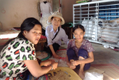 Sr. Agnes Hoang Minh Trang (center) visits two women with visual impairments May 13 in Phu Vang district, in Vietnam. Trang shared her vocation story with young women at Phuong Duc Church on May 8. (Joachim Pham)