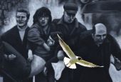 A seagull flies in front of a mural which shows a group of men, led by then-Fr. Edward Daly, right, carrying the body of shooting victim Jackie Duddy during 1972's Bloody Sunday in Derry, Northern Ireland. (CNS/Reuters/Cathal McNaughton)