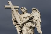A statue of an angel carrying Christ's cross is seen on the Castel Sant'Angelo bridge in Rome. (CNS/Paul Haring)