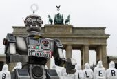 Activists from the Campaign to Stop Killer Robots, a coalition of nongovernmental organizations opposing lethal autonomous weapons, protest at the Brandenburg Gate in Berlin March, 21, 2019. (CNS photo/Annegret Hilse, Reuters)