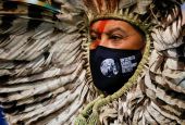 Indigenous Amazon delegate Romancil Gentil Kreta, wearing a protective mask with a logo of the U.N. Climate Change Conference, looks on during the conference in Glasgow, Scotland, Nov. 3, 2021. (CNS photo/Phil Noble, Reuters)