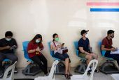 People wait for a booster dose of the COVID-19 vaccine in Manila, Philippines, on Jan. 5. (CNS/Reuters/Eloisa Lopez)