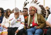 A man is comforted by an Indigenous leader during ceremonies in Maskwacis, Alberta, July 25, 2022, where Pope Francis apologized to Canada's native people on their land for the church's role in schools where Indigenous children were abused. (CNS photo/Ada