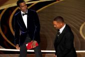 The comedian Chris Rock, left, reacts after actor Will Smith slaps him onstage during the 94th Academy Awards at the Dolby Theatre in Los Angeles March 27. (AP/Chris Pizzello)