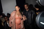 Rihanna, left, and ASAP Rocky arrive for the Off-White Ready To Wear Fall/Winter 2022-2023 fashion collection, unveiled during Fashion Week in Paris Feb. 28. Rihanna's pregnancy became public Jan. 31 with a photo of her baring her baby bump. (AP/Invision/