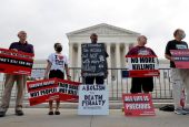 Death penalty protesters are seen outside the U.S. Supreme Court building in Washington Oct. 13, 2021. With Roe v. Wade overturned, the president of the Pontifical Academy for Life, urges Catholics to continue fighting to protect life in all its forms.