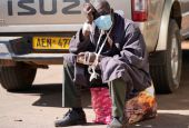 A man sits after being refused medical assistance at Parirenyatwa Hospital in Harare, Zimbabwe, June 21. A strike by health workers has left Zimbabwe's major hospitals in near paralysis. (AP/Tsvangirayi Mukwazhi)