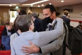 Olivier Savignac, right, one of the victims, greets an attendee during the publishing of a report by an independant commission into sexual abuse by church officials (Ciase), Tuesday, Oct. 5, 2021, in Paris. A major French report released Tuesday found tha