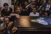 Mourners attend a memorial service for victims of a fire at a church in Greater Cairo that killed dozens on Aug. 14. (AP/Tarek Wajeh)