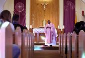 Fr. Athanasius Abanulo celebrates Mass at Holy Family Catholic Church in Lanett, Alabama, on Sunday, Dec. 12, 2021. (AP/Jessie Wardarski)