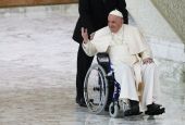 Pope Francis arrives in a wheelchair to attend an audience with nuns and religious superiors in the Paul VI Hall at the Vatican May 5. (AP file/Alessandra Tarantino)