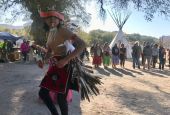 Waya Brown, who is Apache and Pomo, dances in a circle at Oak Flat campground on Saturday, Feb. 27, 2021, near Superior, Arizona. (RNS/Alejandra Molina)