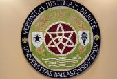 A mosaic of the seal of the University of Dallas is seen in the Haggar Student Center in Irving, Texas. (Wikimedia Commons/Wissembourg)