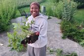Ylanda Wilhite, photographed by her mother, Lisa, holding home grown potatoes in the back yard. (Courtesy of Lisa Wilhite)