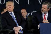 President Trump, left, sits before delivering the keynote address at Liberty University’s commencement in Lynchburg, Va., on May 13, 2017. Seated on the right is Liberty University President Jerry Falwell Jr. (Yuri Gripas/Reuters)