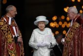 Britain's Queen Elizabeth II smiles as she leaves St. Paul's Cathedral with the Revs. David Ison and Michael Colclough following a thanksgiving service to mark her diamond jubilee in London June 5, 2012. (CNS/Reuters/Andrew Winning)