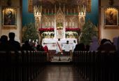 Worshipers kneel in prayer during eucharistic adoration following a Mass marking the feast of the Holy Innocents Dec. 28, 2020, at the Church of the Holy Innocents in New York City. (CNS/Gregory A. Shemitz)