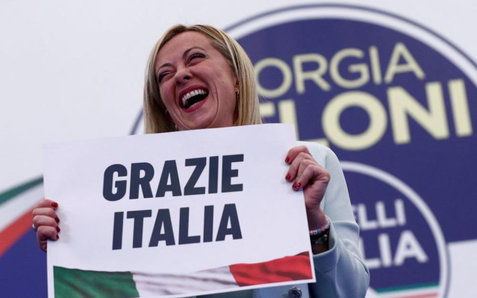 Giorgia Meloni, leader of Brothers of Italy, holds a sign at the party's election night headquarters in Rome Sept. 26. Italian voters handed a victory to a coalition of center-right parties and set the stage for Meloni to become the next prime minister. 