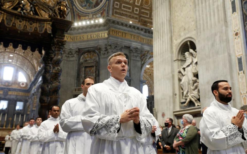 Seminarians from the Pontifical North American College walk in procession during the ordination of new deacons in St. Peter's Basilica at the Vatican in September. (CNS/Paul Haring)