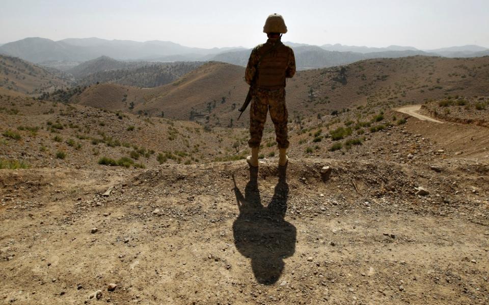 A soldier in North Waziristan, Pakistan, stands guard along the border fence with Afghanistan Oct. 18, 2017. (CNS/Reuters/Caren Firouz)