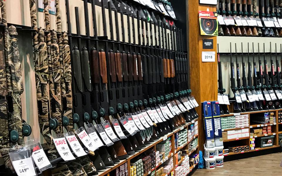 Rifles are seen inside the gun section of a sporting goods store. (CNS/Eduardo Munoz, Reuters)