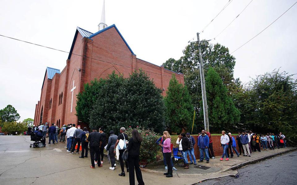 A line of voters wraps around Our Lady of Lourdes Catholic Church in Atlanta during midterm elections Nov. 6, 2018. (CNS/Reuters/Lawrence Bryant)