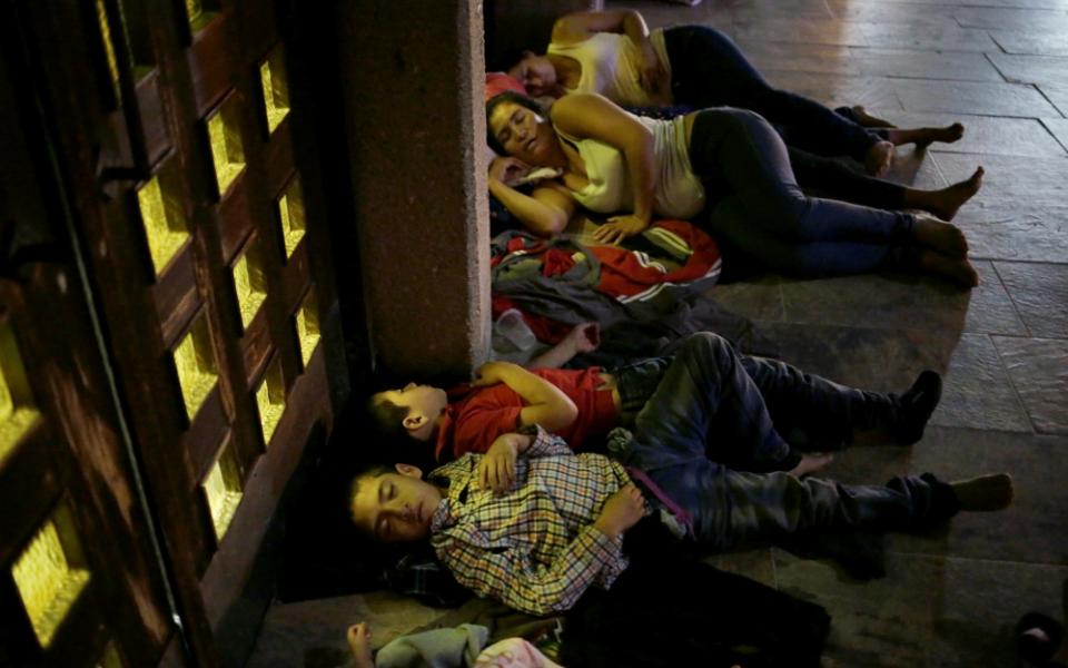 Central American migrants sleep outside Our Lady of Guadalupe Cathedral in Ciudad Juárez, Mexico, July 14. (CNS/Reuters/Jose Luis Gonzalez)