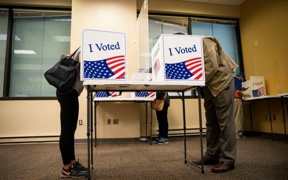 People fill out their ballots at an early voting site in Arlington, Virginia, Sept. 18. (CNS/Reuters/Al Drago)