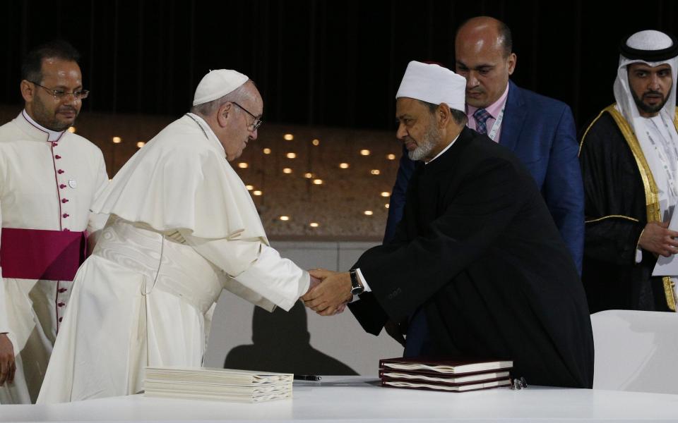 Pope Francis shakes hands with Sheik Ahmad el-Tayeb, grand imam of Egypt's al-Azhar mosque and university, during a document signing at an interreligious meeting at the Founder's Memorial in Abu Dhabi, United Arab Emirates, in this 2019 file photo (CNS)