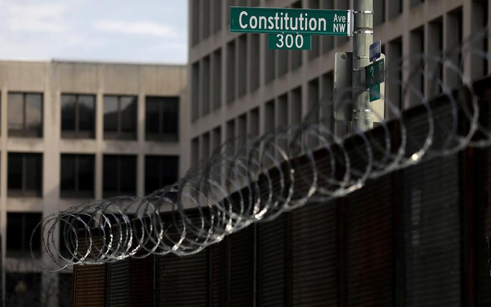 Fencing topped with razor wire surrounds buildings on Capitol Hill in Washington Feb. 9, the first day of the second impeachment trial of former President Donald Trump. (CNS/Leah Millis, Reuters)