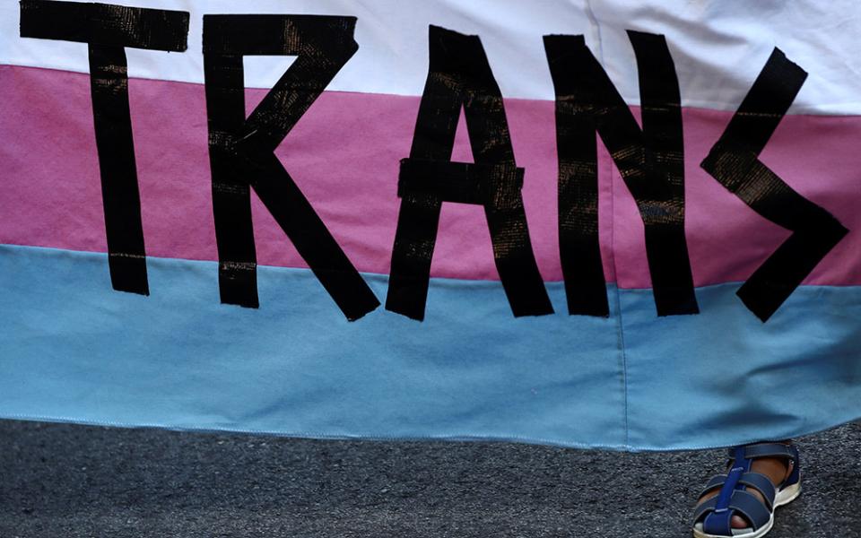 Pete, 9, a transgender minor, holds a banner as he takes part in a protest to mark LGBT Pride Day in Madrid, June 28. (CNS/Reuters/Sergio Perez)