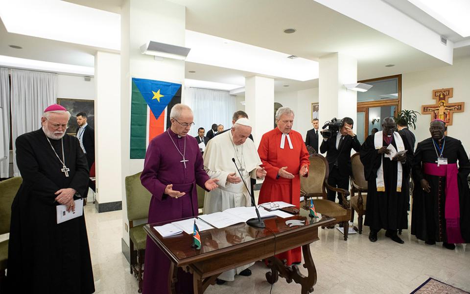 Pope Francis prays alongside Archbishop Paul Gallagher, the Vatican's foreign minister, Anglican Archbishop Justin Welby of Canterbury, and the Rev. John Chalmers, former moderator of the Presbyterian Church of Scotland, April 11, 2019, at the conclusion 