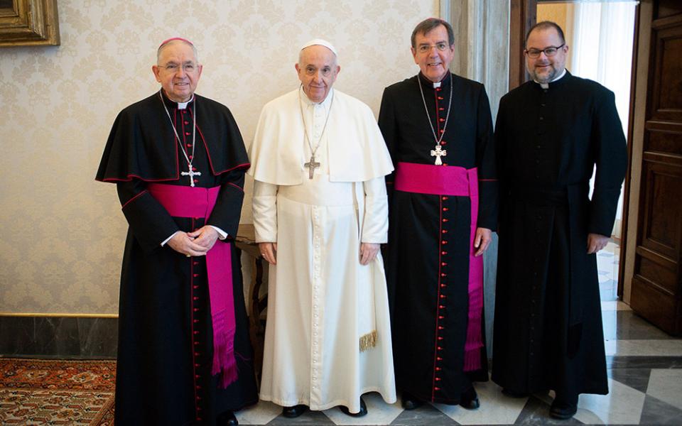 Pope Francis poses with Archbishop José Gomez, president of the U.S. bishops' conference, Archbishop Allen Vigneron, vice president, and Fr. Michael Fuller, interim general secretary, Oct. 11 at the Vatican. (CNS/Vatican Media)