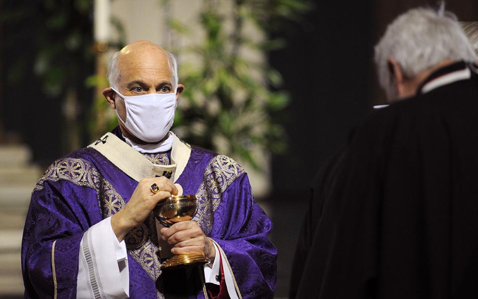 Archbishop Salvatore Cordileone distributes Communion during a Mass for the homeless at San Francisco's Cathedral of St. Mary of the Assumption Nov. 6, 2021. (CNS/David Maung)